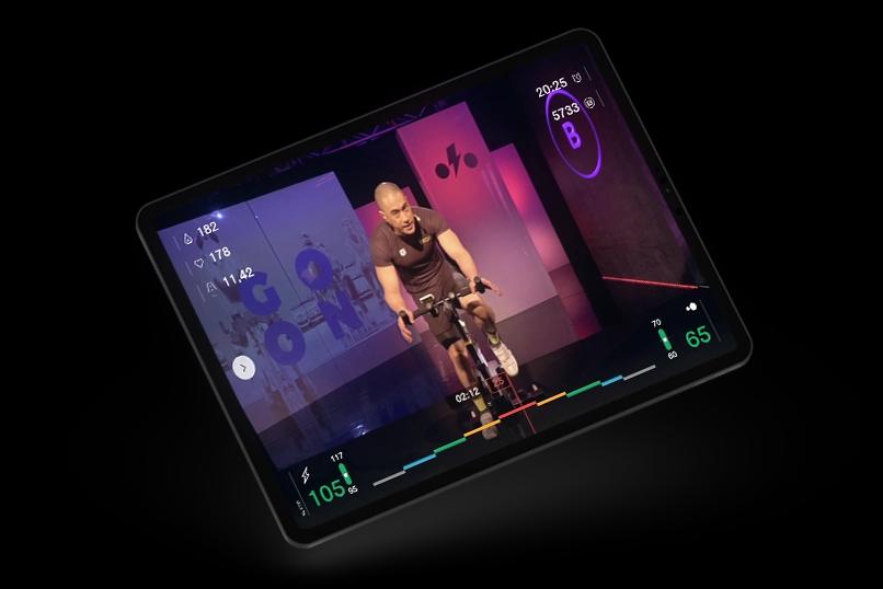 Cyclist training cycling at home with an indoor cycling simulator